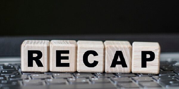 concept word RECAP on cubes against the background of laptop keys